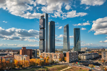 Madrid Spain, city skyline at financial district four towers with autumn foliage season