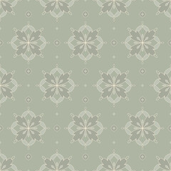 Seamless repeating motif pattern in shades of green.
