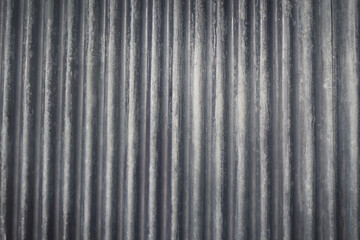 Metal sheet gray textured wall or metal sheet floor tile roofing material close-up roof texture