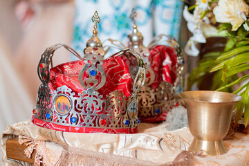 Fototapeta na wymiar Wedding church crowns. Christian relics. Wedding ceremony. Orthodox and Catholic rites