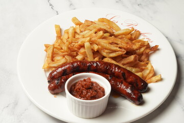 grilled sausages with fries