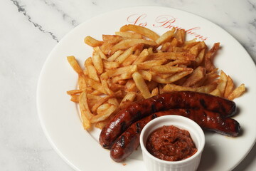 grilled sausages with fries