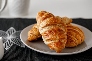 Croissant on plate - freshly baked pastry