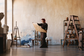 Young white woman painter in an art studio