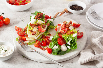 romaine lettuce topped with bacon tomato parmesan, sauce. healthy keto paleo diet lunch