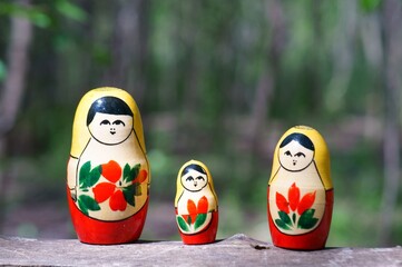 Figures of matryoshka dolls in close-up. The dolls are standing in a row.