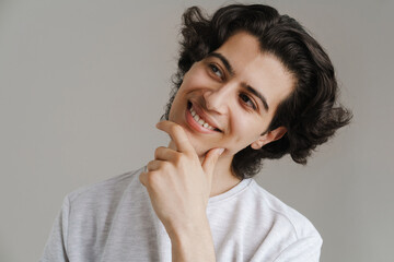 Close up of a smiling young brunette man