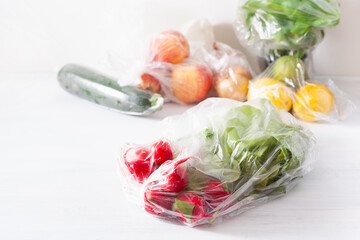 single use plastic waste issue. fruits and vegetables in plastic bags