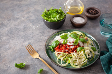 keto paleo zoodles bolognese: zucchini noodles with meat sauce and parmesan