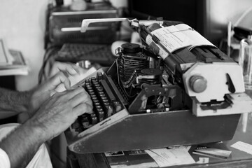 Typist working on Typewriter still in use