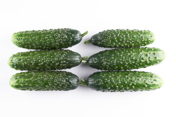 Set of fresh whole cucumbers isolated on a white background, clipping path. Garden cucumber wallpaper backdrop design