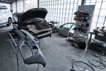 Repair of an old broken car at auto service
