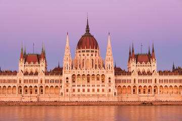 Fototapeta na wymiar Budapest, Hungary. A classic view of the historic parliament building. Danube River and Parliament during sunset. .