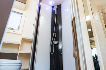 Shower cabin integrated into the interior of a caravan - obrazy, fototapety, plakaty