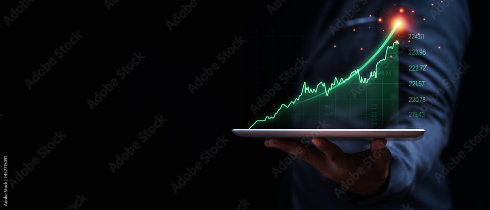 Aufkleber businessman holding tablet with increasing virtual investment graph and chart for stock market analy