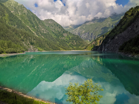 Panoramic view of the turquoise water of Lago dei Cavalli (Lake of Horses) in Antrona Valley, Piedmont Italy