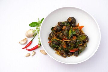 river snail,snail curry on a white bowl on a white background.Thai food