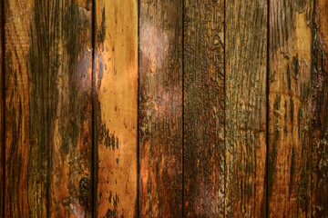 Cracked old wooden background from brown vertical planks.