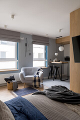 Fototapeta na wymiar Modern studio apartment with bedroom open to kitchen