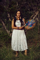 Woman Holding Creative Shaman Drum In Forest