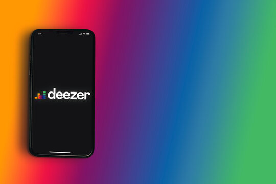 Deezer online music app on smartphone screen on colorful background. Top view. Rio de Janeiro, RJ, Brazil. May 2021.