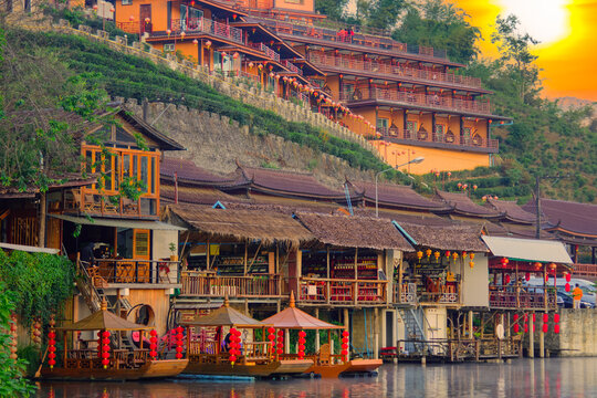 Beautiful scenery during sunrise with the water reflection of the Chinese village at the Lee wine ruk thai lake, Mae Hong Son off Thailand.