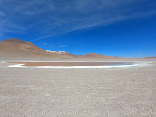 A small salt lake in the stone desert of Bolivia near the city of Uyuni. Eduardo Avaroa Andean Fauna National Reserve