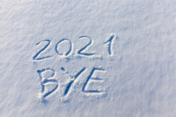 the inscription about the new year 2022 on the snow in winter