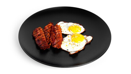 Fried eggs with fried bacon isolated on a white background.