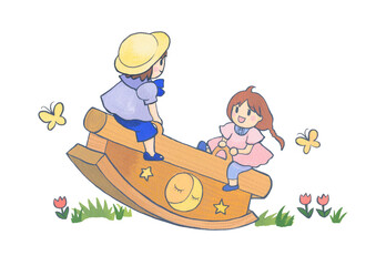 公園のシーソーで遊ぶ子どもたち