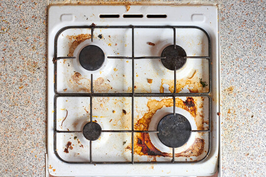 Dirty stove with food leftovers