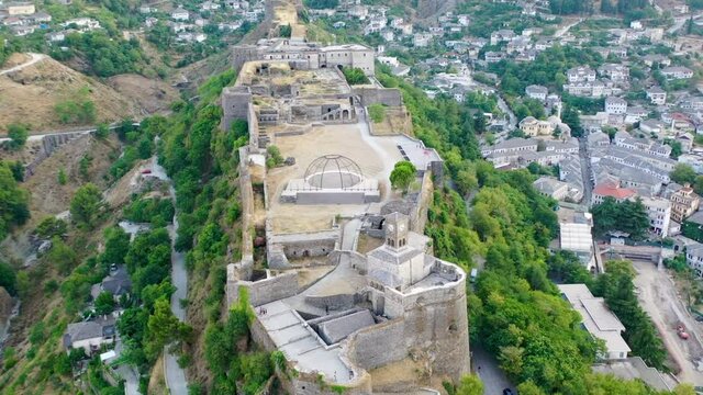 Castle of Gjirokastra and city center. Aerial view of ancient fortress Albania