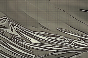 Gray abstraction with curved lines on a checkered background. A crumpled, distorted surface. Pencil drawing.