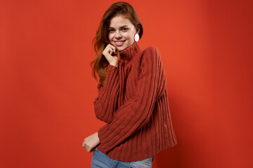 cheerful woman in a red sweater makeup earrings fashion studio