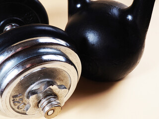 Sports equipment. Weight training kettlebell, sports equipment, dumbbells covered