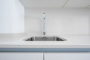 Single bowl sink in light gray silestone countertop and stainless steel tap