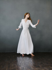 pretty woman in white dress posing full length Studio Model