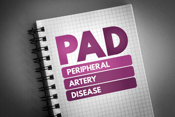 PAD - Peripheral Artery Disease acronym on notepad, health concept background