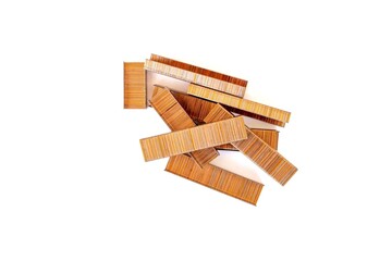 Brown staples isolated on white background. Top view, flat lay.