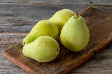 fresh pears on wood background
