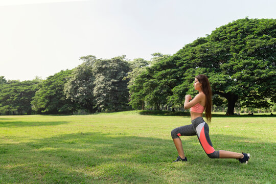 Healthy Young Teenage Girl Stretching Arms Workout And Warmup Before Fitness Training Session In The Park At Sunday Morning. Life After Covid.