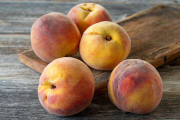 fresh peaches on wood background