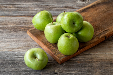 fresh green apple (sour apple) on wood background
