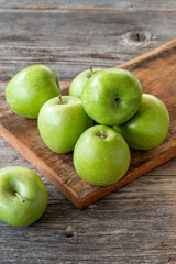 fresh green apple (sour apple) on wood background