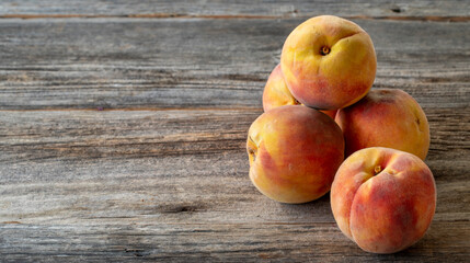fresh peaches on wood background. Copy space