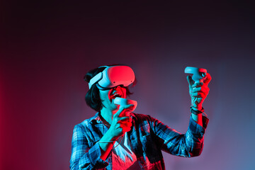 Fototapeta premium Woman action in virtual reality helmet. VR glasses, technology concept