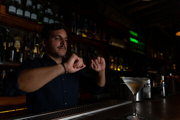 mixologist finalizing details in the glass
