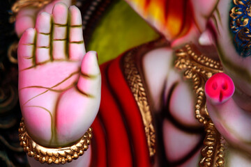 view of Hand in blessing pose of Indian Hindu God Ganesha idol