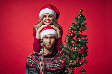 man and woman christmas clothes holiday gift red background