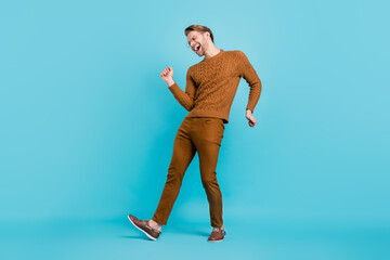 Full body photo of young man funky mood sing dance wear glasses smile isolated on blue color background